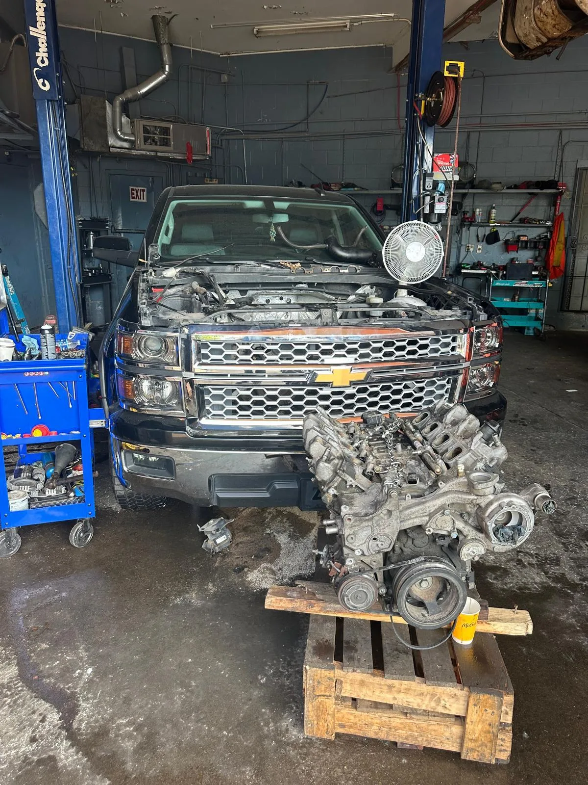 Chevrolet truck with its engine removed inside Villeda’s Workshop